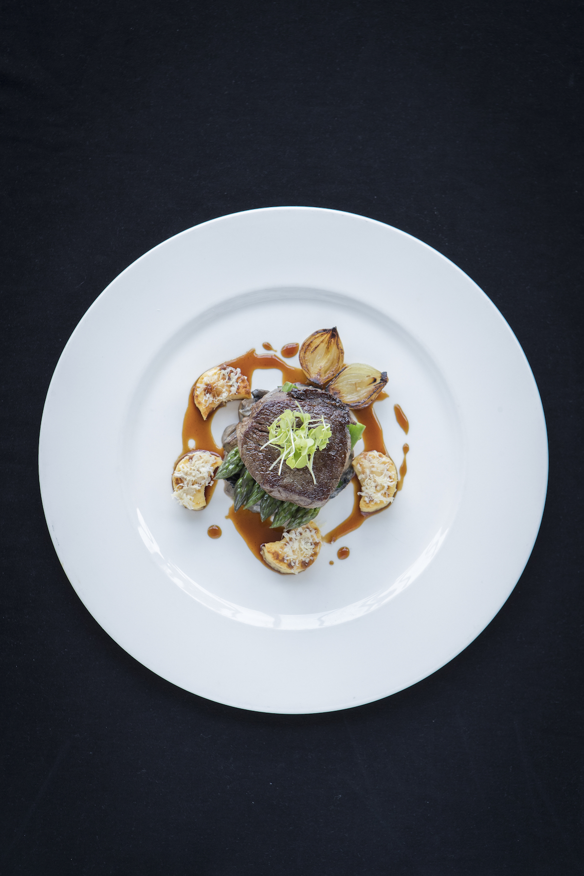 Chameleon Restaurant at the Intercontinental Wellington dish: Silver Fern Farms beef tenderloin, mushroom ragout, roast Parmesan gnocchi, button onion and asparagus. 