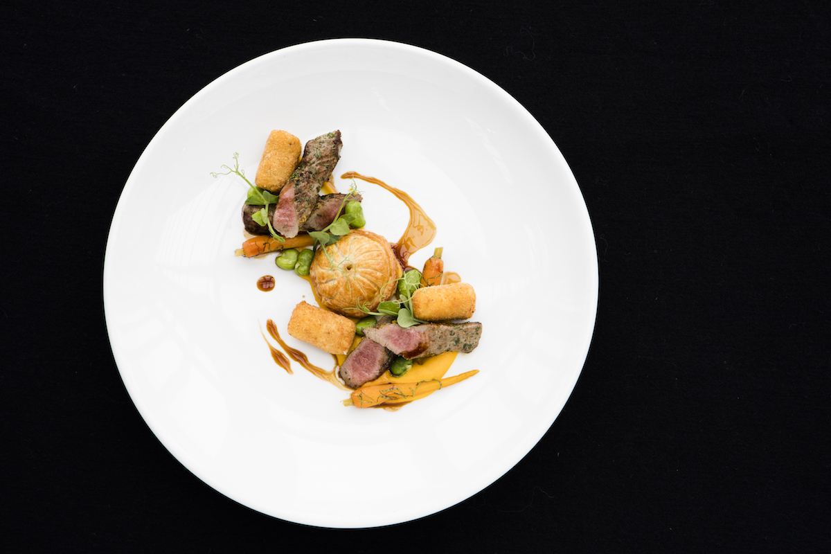 Shed 5 dish: Cumin gremolata Silver Fern Farms lamb fillet, lamb neck and swede pithivier, honey and mint carrot, broad beans, chevre croquette, braising liquor. 