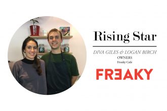 Diva Giles and Logan Birch stand in their cafe, Freaky
