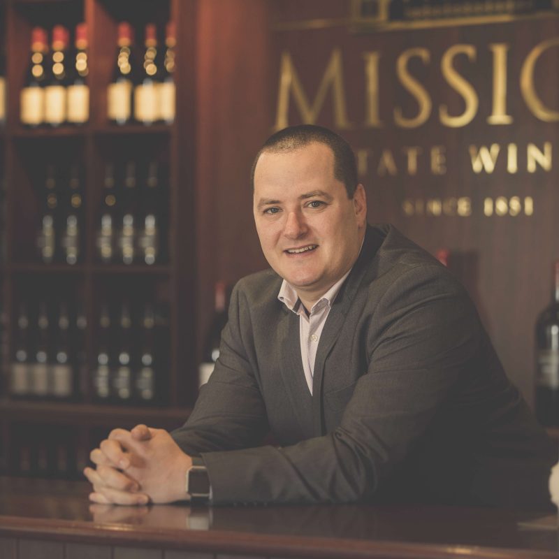 Avram Deitch at a Mission Estate Winery desk.