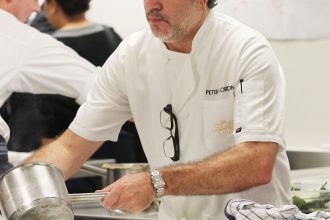 Peter Gordon prepares dishes for a Dining with a Difference event