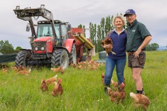 Maurice and Neroli in front of tractor