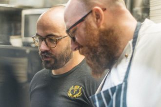 Two men working in kitchen