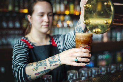 Girl pouring tap beer
