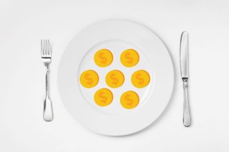 dinner plate with dollar coins on it