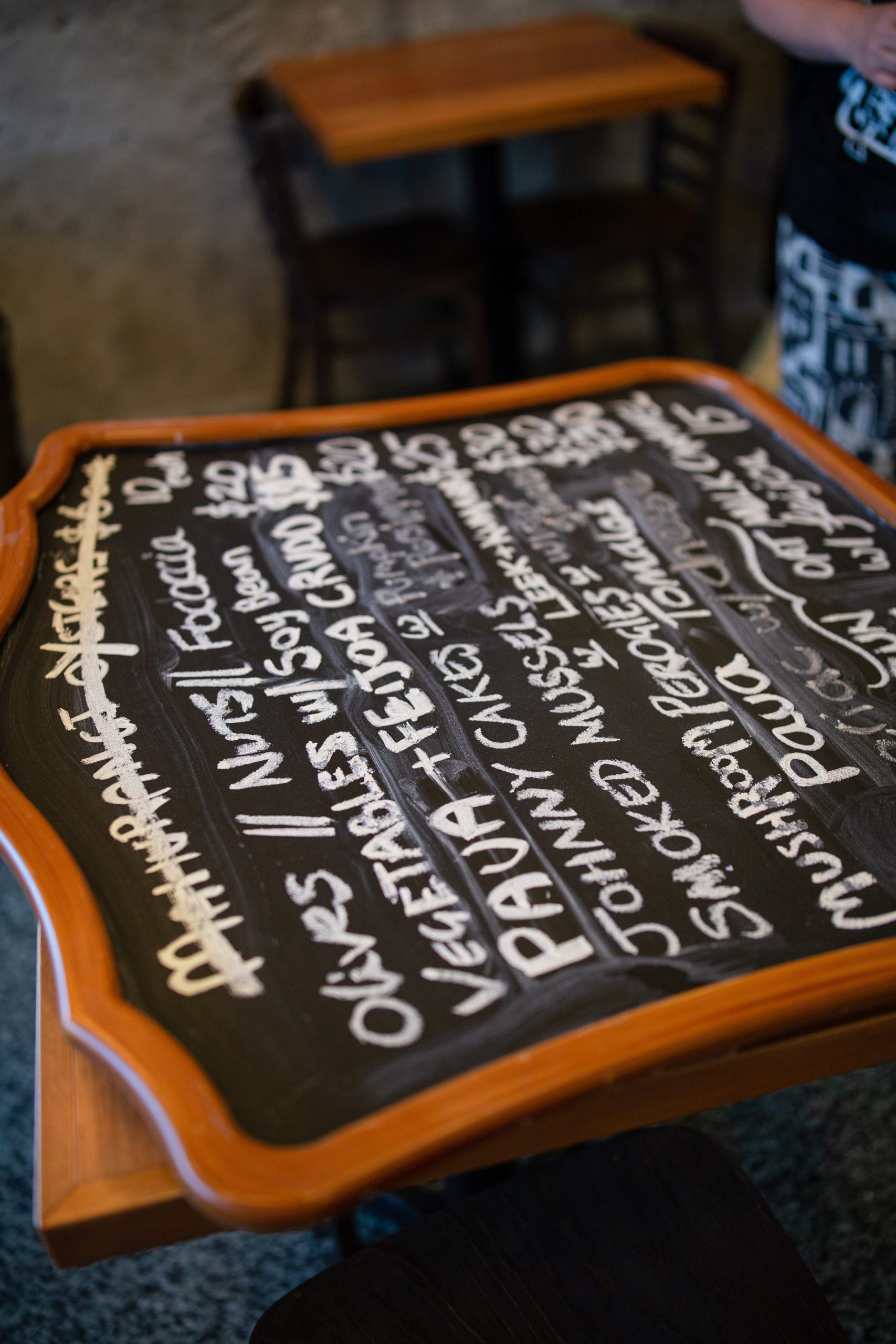 close up of chalk board restaurant menu