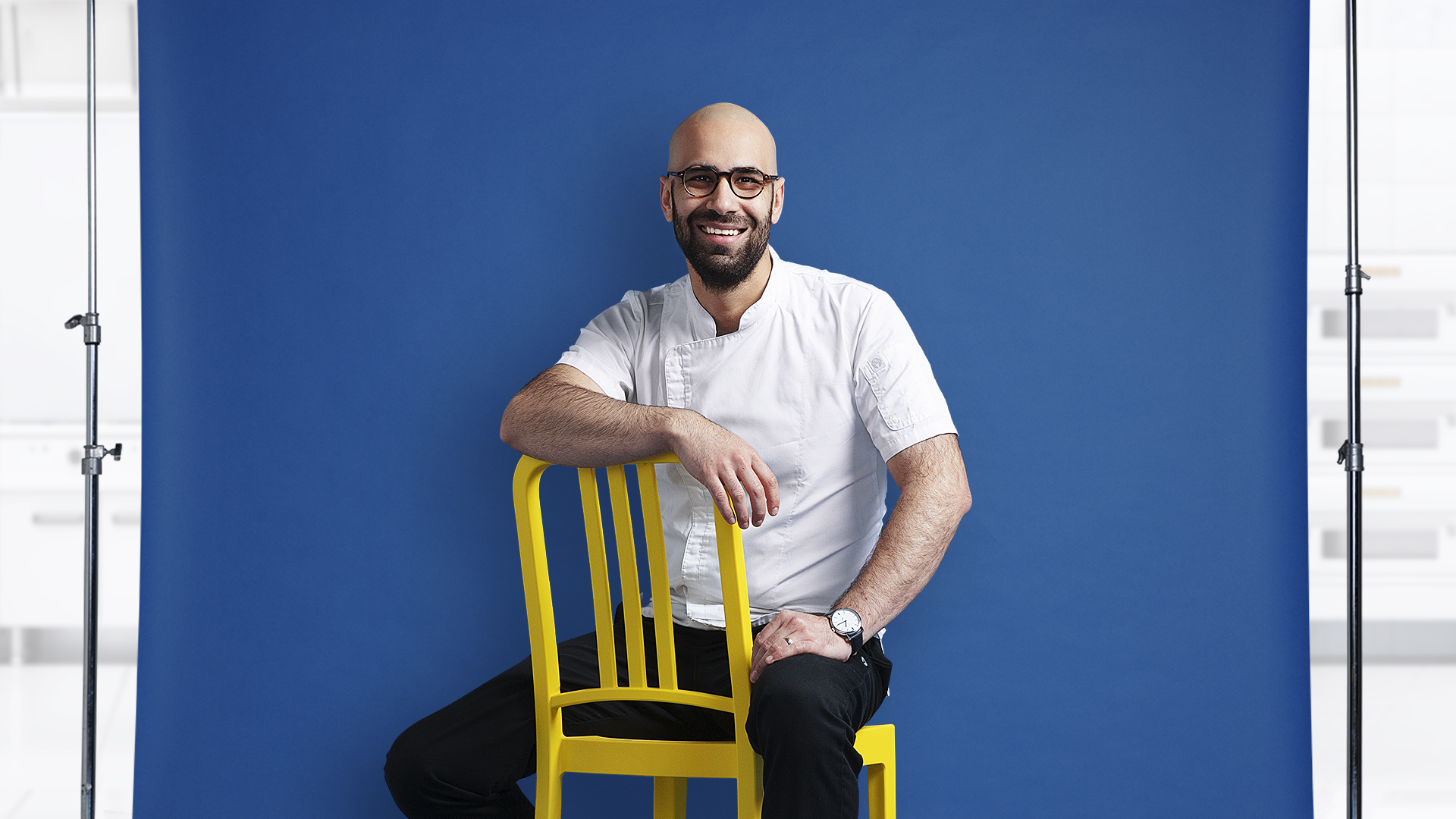 Male Chef sitting on chair smiling